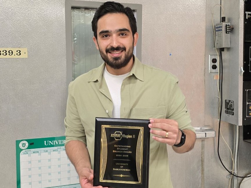 me holding the plaque 4 3